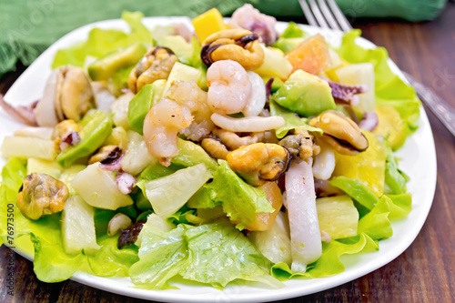 Salad seafood and avocado on board