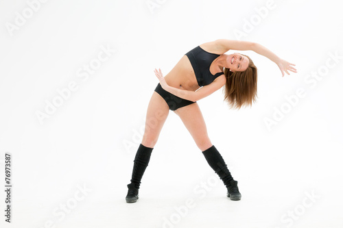 athletic young woman bent sideways