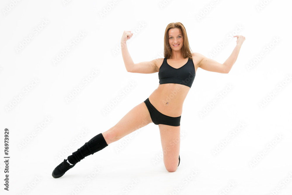 athletic young woman straining muscles and smile