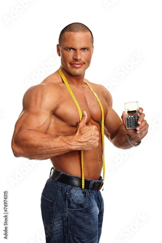 Handsome muscular man with meter and shows you calculator