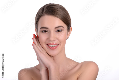 Young beautiful girl posing on white background