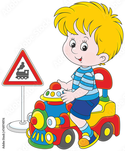 Boy on a toy train