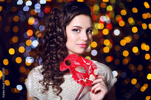 Beautiful girl with masquer...