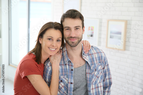 Portrait of cheerful 30-year-old couple