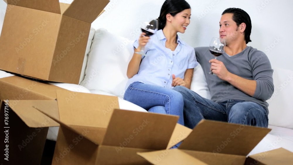 Ethnic Couple Relaxing New Home Glass Wine Ethnic Couple Relaxing New Home Glass Wine