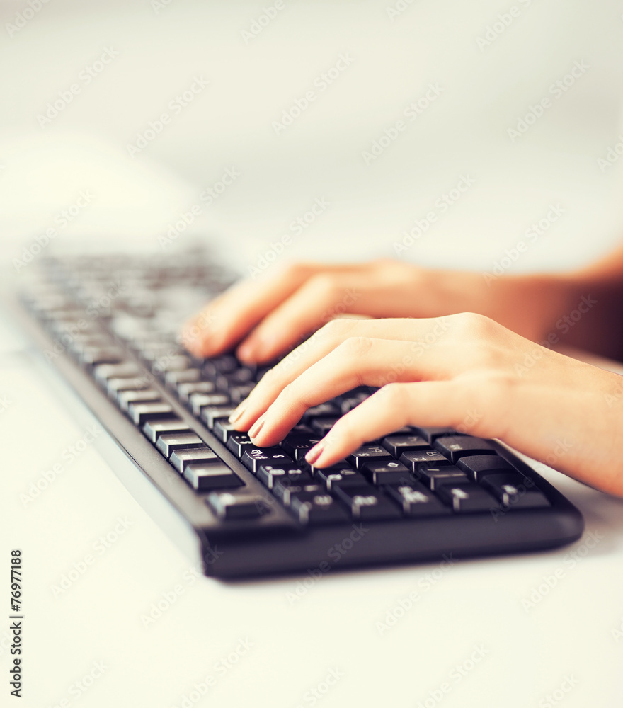 woman hands typing on keyboard woman hands typing on keyboard