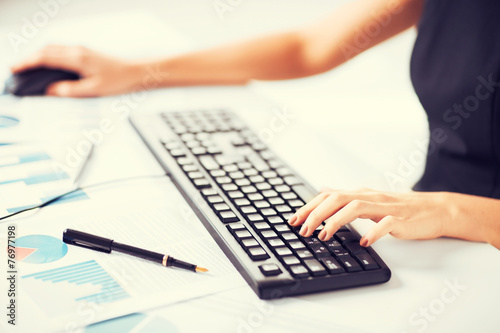 woman hands typing on keyboard