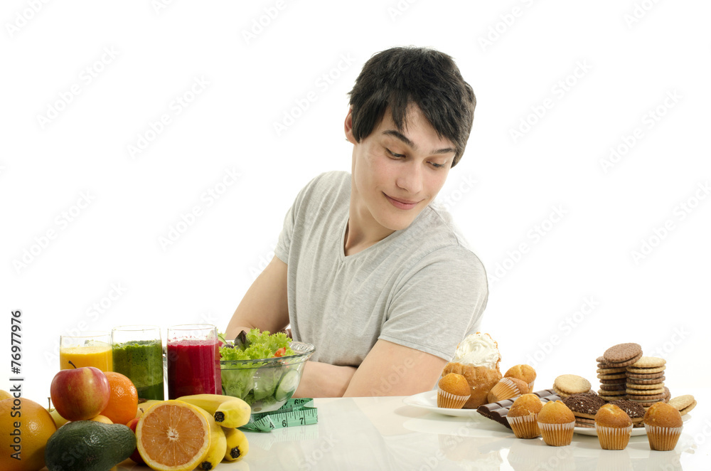 Man choosing between fruits, smoothie, healthy food and sweets Man choosing between fruits, smoothie, healthy food and sweets