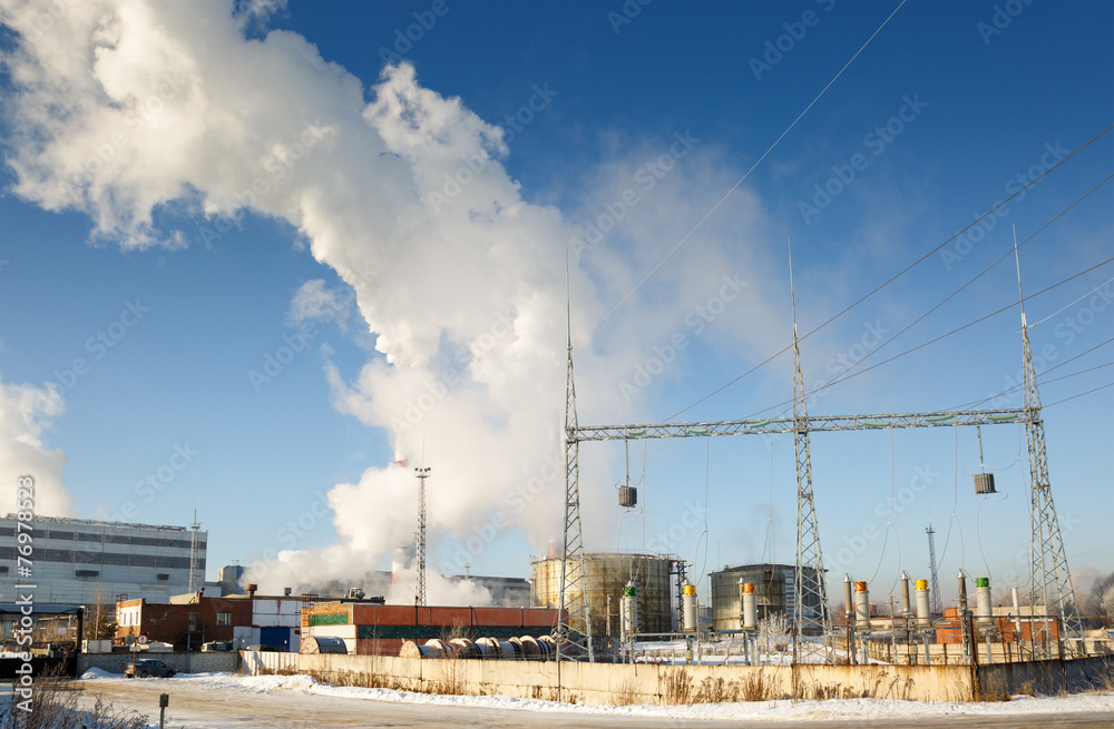 Day view of power plant, smoke from the chimney Day view of power plant, smoke from the chimney