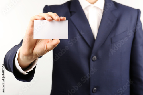 Businessman with business card, close-up