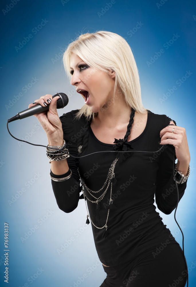 Woman singing on blue background Woman singing on blue background
