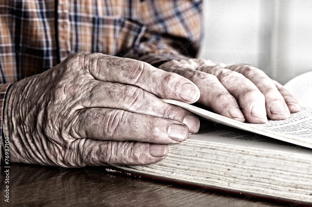 Male hands with book