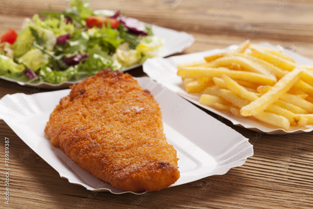 Fried fish and chips on a paper tray Fried fish and chips on a paper tray