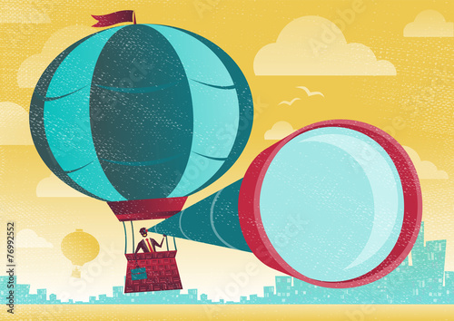 Businessman has a great view in a Hot Air Balloon.