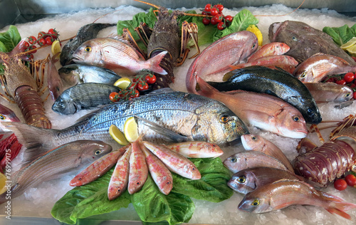 great white sea bream many saltwater fish in the italian restaur #76999175