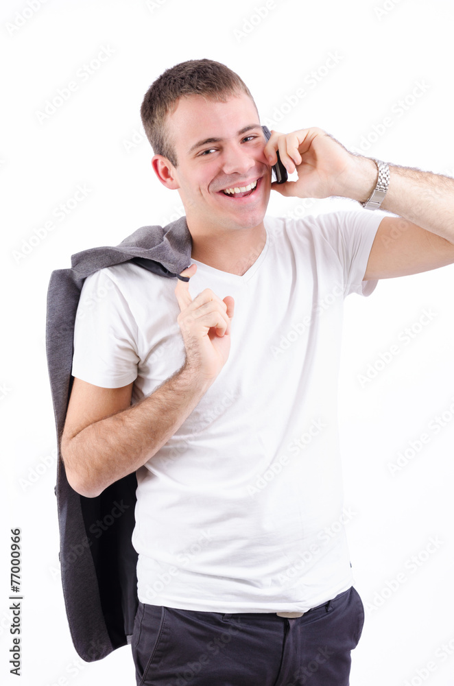 Handsome young male model speaking on the phone Handsome young male model speaking on the phone