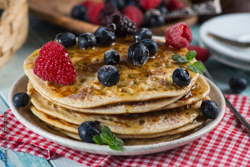 Delicious summer breakfast with fresh berries fruits and sirup Delicious summer breakfast with fresh berries fruits and sirup