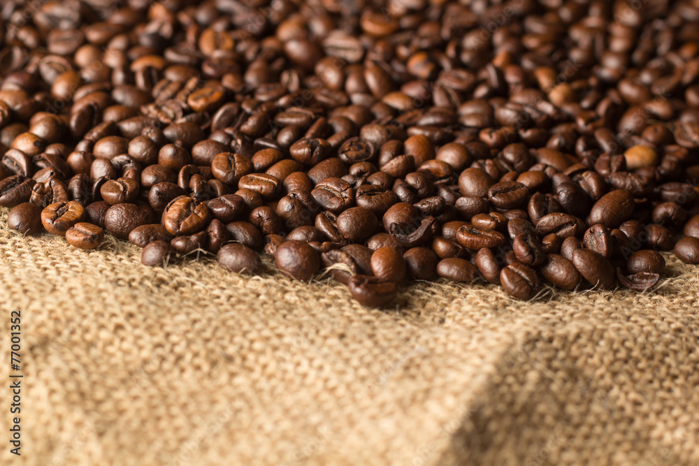 Coffe beans on a Burlap material Coffe beans on a Burlap material