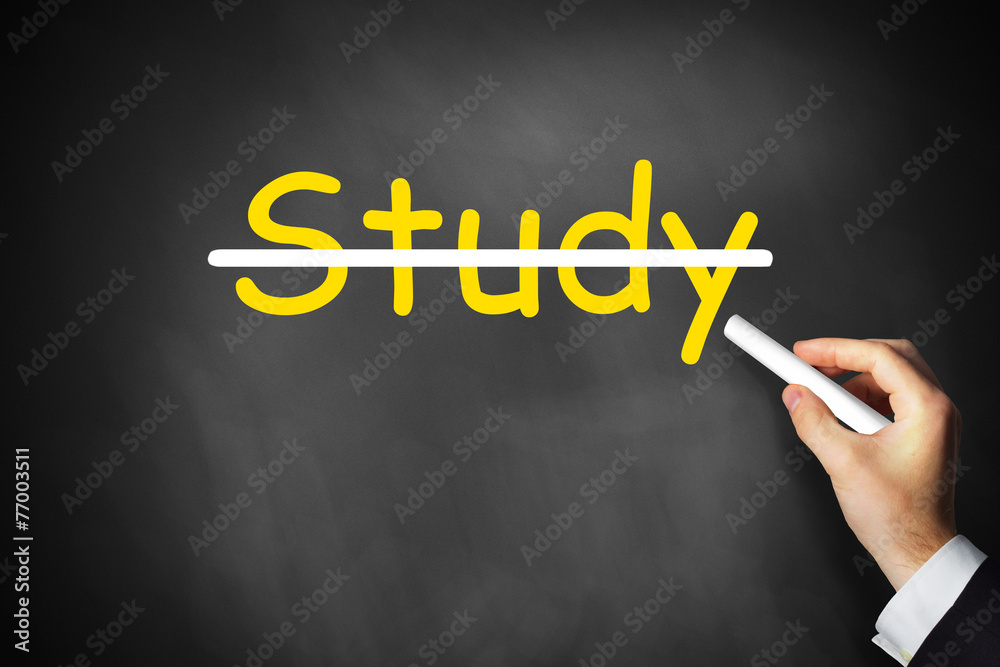 hand crossing out study written on chalkboard hand crossing out study written on chalkboard