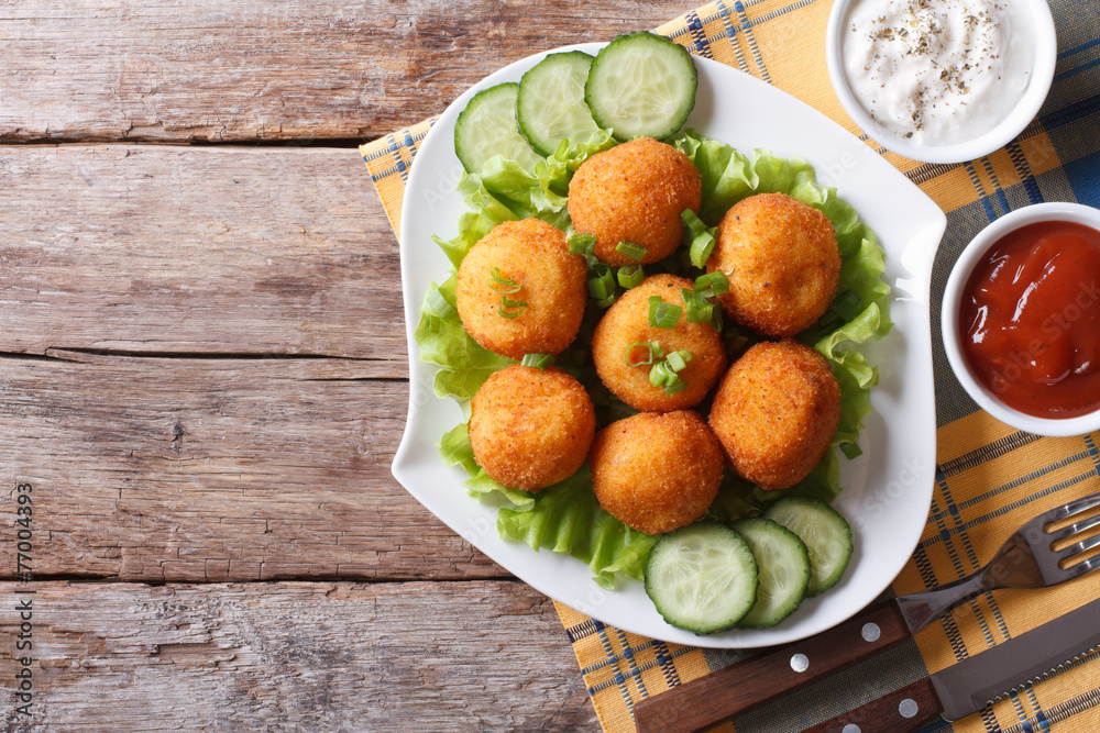 potato croquette with sauce on a plate top view horizontal potato croquette with sauce on a plate top view horizontal