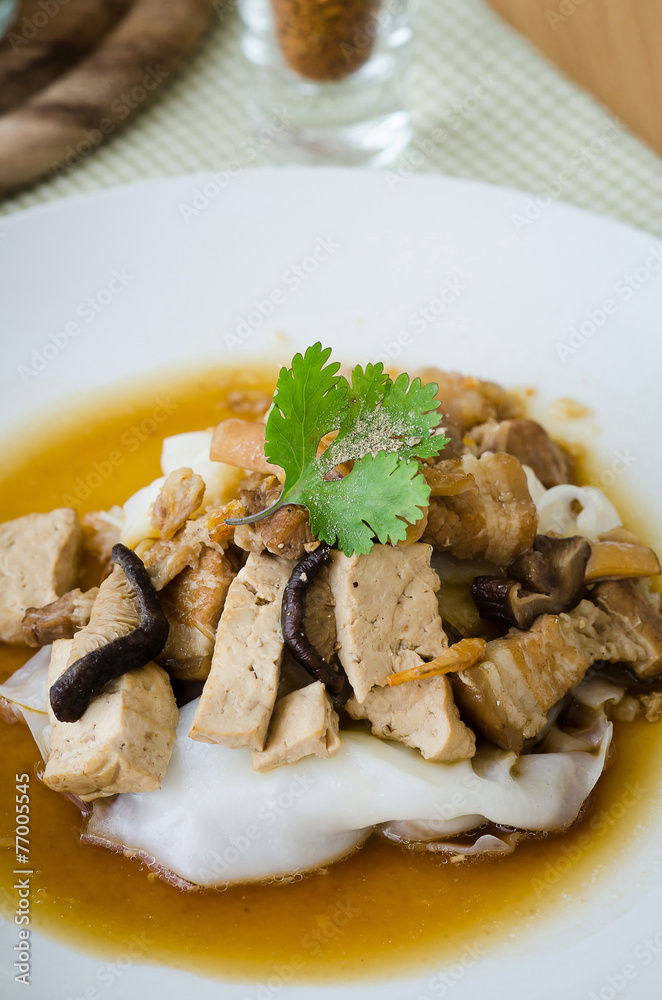 Asian Style flat rice noodles in  gravy pork
