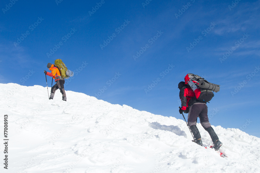 Winter hiking in snowshoes.