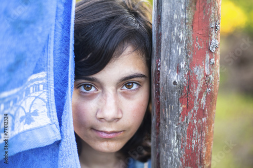 Young girl with expressive eyes, close-up portrait outdoors. © De Visu
