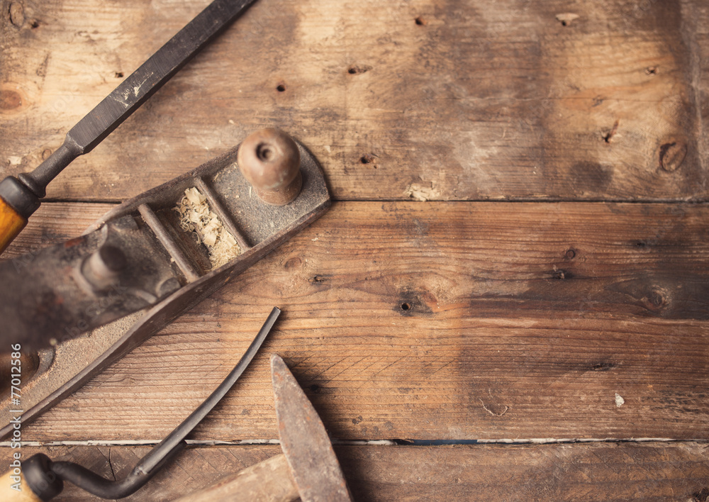 Od vintage hand tools on wooden background. Carpenter workplace. Photos |  Adobe Stock