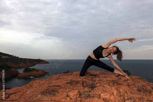 Fitness stretching on the rocks