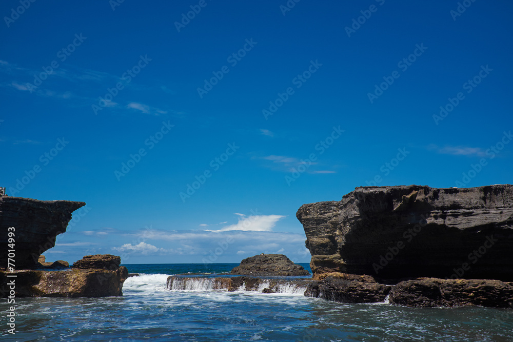 Tropical beach with volcanic rocks, Bali, Indonesia
