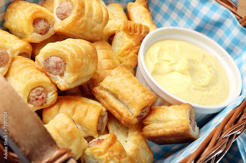 White sausage in puff pastry with joppie sauce