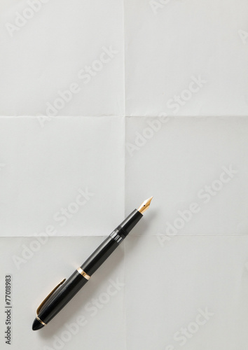 pen and white sheet of paper