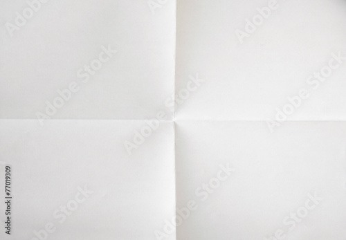 white sheet of paper folded in four