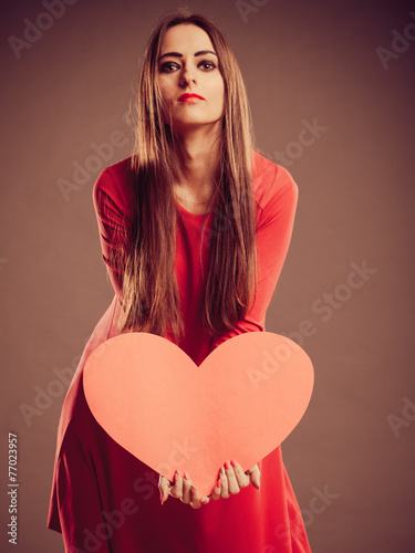 Valentines Day woman holding heart.
