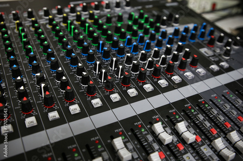 Hand on a Mixing Desk Fader in Television Gallery,