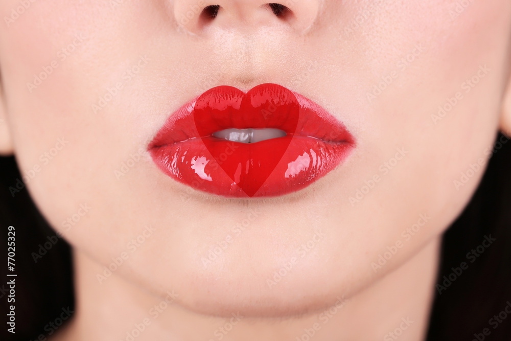 Obraz premium Love concept. Sexy lips with heart shape paint, closeup