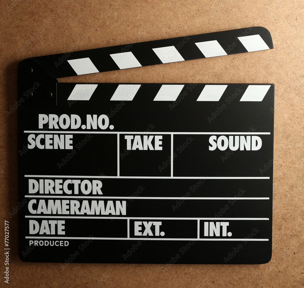 Fototapeta premium Movie clapper on wooden background