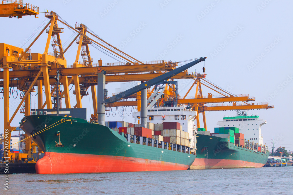 commercial ship with container on shipping port for import expor