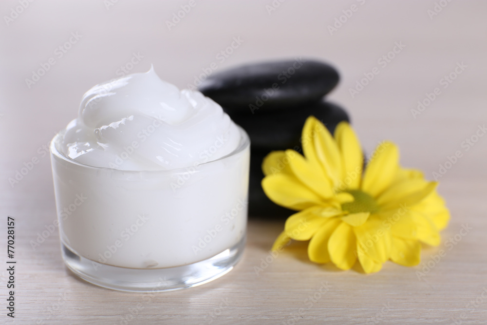Cosmetic cream with spa stones and chamomile Cosmetic cream with spa stones and chamomile