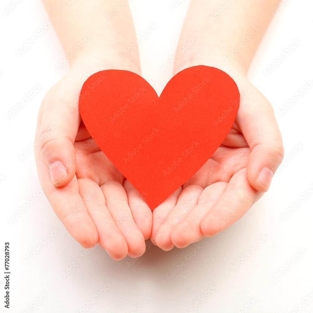 Heart in child hands isolated on white Heart in child hands isolated on white