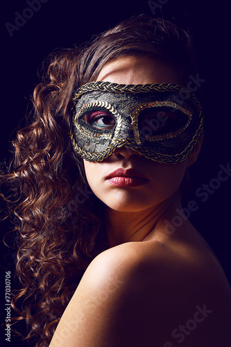 Beautiful girl with masquer...