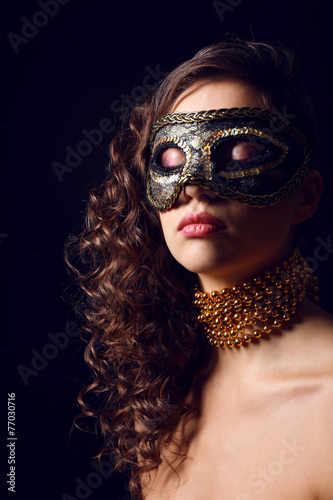 Beautiful girl with masquer...