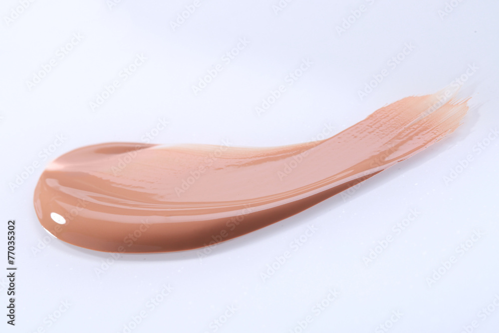 Smeared Liquid Beige Make Up Foundation on White Background Smeared Liquid Beige Make Up Foundation on White Background