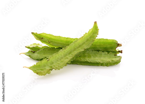 fresh winged bean on white background photo