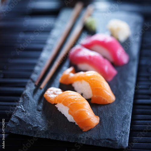salmon and tuna sushi on slate