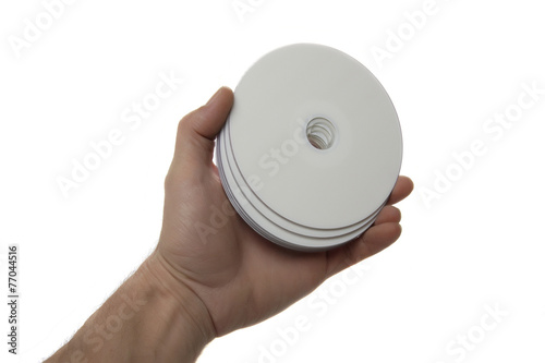  Hand with compact disks, isolated on white background photo