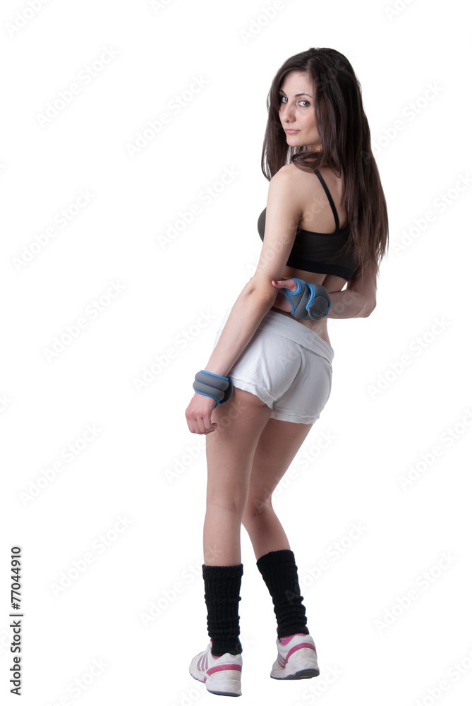 Young athletic woman with wrist weights Young athletic woman with wrist weights
