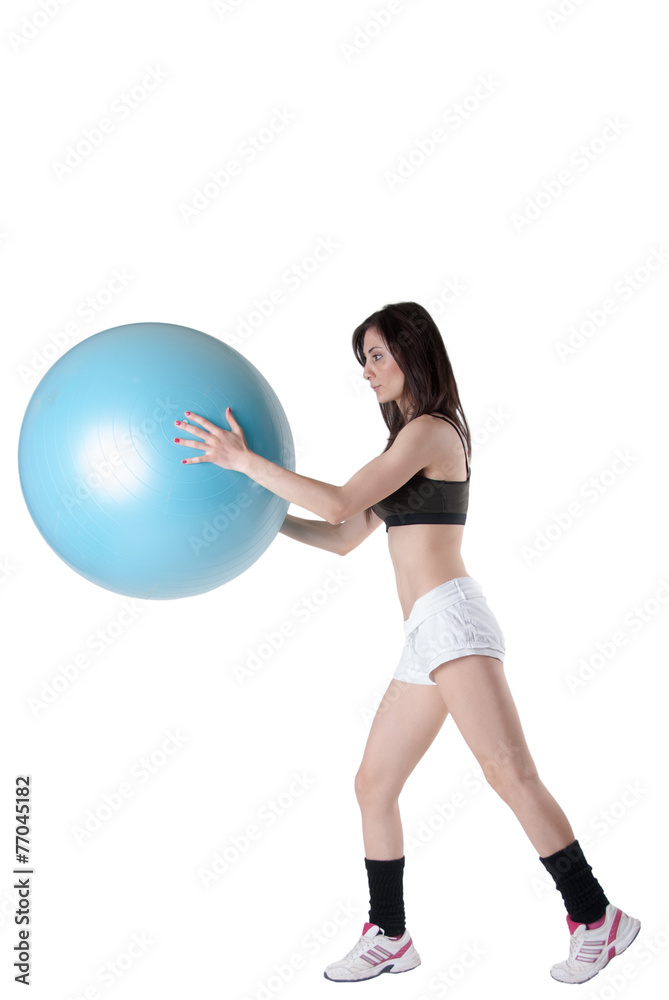 Young athletic woman with blue exercise ball Young athletic woman with blue exercise ball