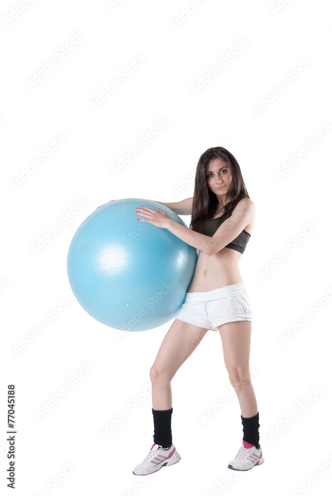 Young athletic woman with blue exercise ball Young athletic woman with blue exercise ball