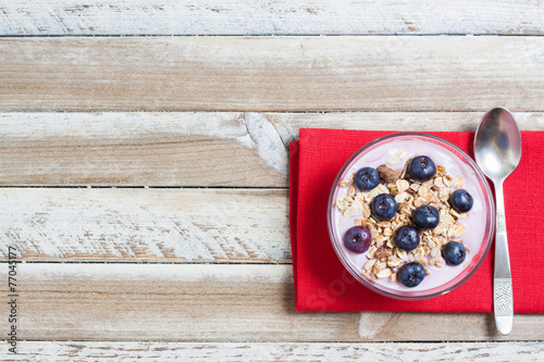 Yogurt with blueberries and muesli, free space on left